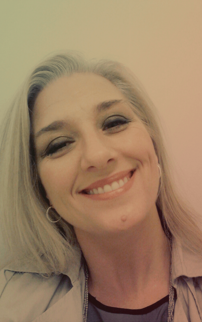 A photograph of actress Elizabeth Friesen smiling.