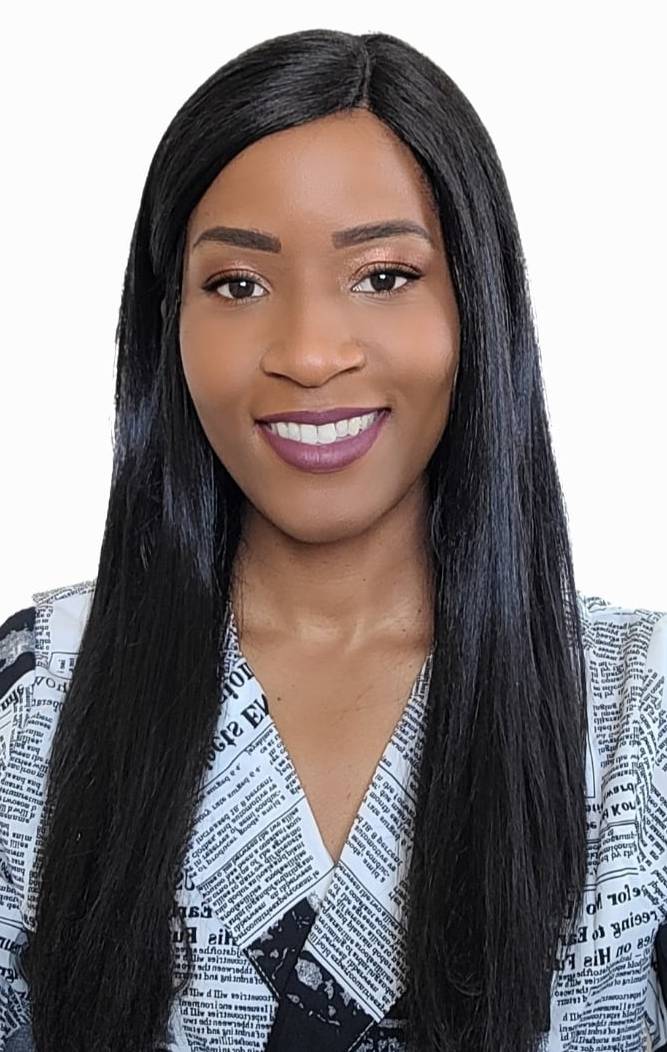 A photograph of publicity manager Trisha Harlan wearing a newspaper printed top.